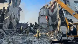 Rescuers work amid debris of a destroyed building in the Russian-occupied town of Starobilsk of eastern Ukraine. Photo: 22 May 2026