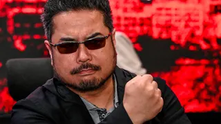 Katsuhiro Harada holds a fist up