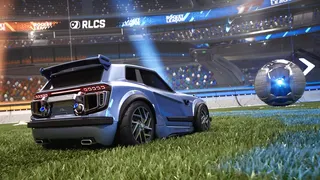 Image from Rocket League's New Era trailer showing a car chasing a metallic ball across the pitch in a busy stadium.
