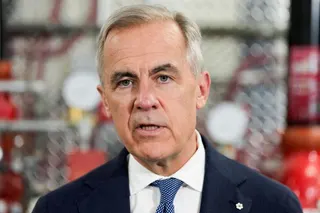 FILE PHOTO: Canada's Prime Minister Mark Carney speaks as he meets unionized skilled trades workers at the United Association of Journeymen and Apprentices of the Plumbing and Pipefitting Industry of the United States and Canada (UA) office in Calgary, Alberta, Canada, May 15, 2026. REUTERS/Todd Korol/File Photo
