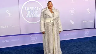 Queen Latifah standing on stage at the American Music Awards in Las Vegas