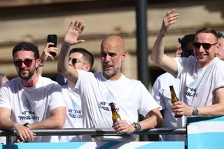 epa12993277 Manchester City manager Pep Guardiola (C) attends an open-top bus parade in Manchester, Britain, 25 May 2026. Manchester City won the League Cup and FA Cup and Manchester City Women won the WSL in the 2025/2026 season. EPA/ADAM VAUGHAN