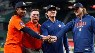 Houston Astros pitchers Alimber Santa, Tatsuya Imai, and Steven Okert posing with catcher Christian Vázquez