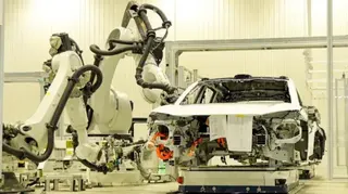 A car being assembled with robots inside the Nio factory in Hefei