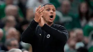 Boston Celtics coach Joe Mazzulla calling to players on sidelines during NBA Finals game