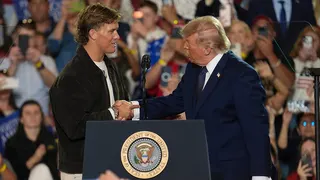 New York Giants quarterback Jaxson Dart greeting President Donald Trump at an event
