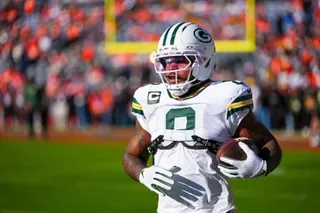 Green Bay Packers running back Josh Jacobs warms up before a December game against the Denver Broncos.