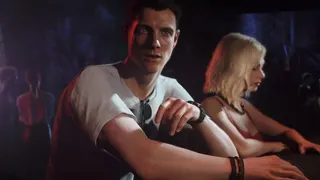 Bond can be seen at the bar standing beside the Girl in Red in 007 First Light.