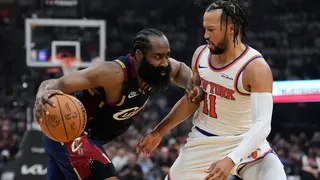 Cleveland Cavaliers guard James Harden dribbling basketball against New York Knicks guard Jalen Brunson