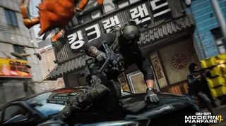 A soldier in Modern Warfare 4 mantling over the hood of a car.