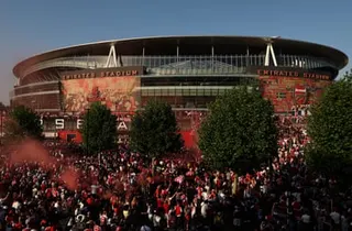 Arsenal fans celebrate at the Emirates Stadium
