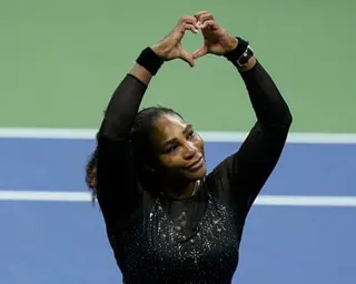 Serena Williams makes a heart sign