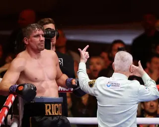 Rico Verhoeven leans against the ropes and watches the referee count him out at the end of his WBC world heavyweight title challenge against Olexsandr Usyk in Giza.
