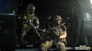 A squad of soldiers in Modern Warfare 4 sat in a helicopter.