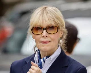 Woman in sunglasses looks ahead