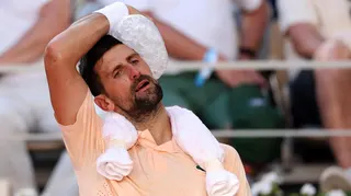 Novak Djokovic uses ice to cool down during his French Open second-round match on Wednesday