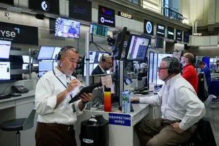 Traders work on the floor of the New York Stock Exchange.