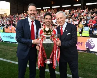 Mikel Arteta, Josh Kroenke and owner Stan Kroenke (right) with the Premier League trophy