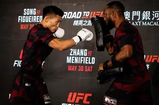 Chinese fighter Song Yadong (left) taking part in a workout session at the opening ceremony of UFC Fight Night at Macau's Galaxy resort on Wednesday. Photo: AFP