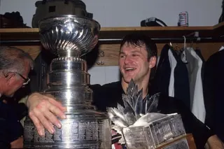 Claude Lemieux with the Stanley Cup and the Conn Smythe Trophy after winning 1995 title with the New Jersey Devils at Meadowlands Sports Complex in East Rutherford, New Jersey.