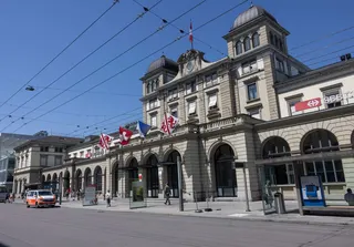 A police vehicle parked in front of the central railway station where a man wounded three people with a bladed weapon in Winterthur, near Zurich on Thursday. Photo: AFP