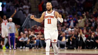 Jalen Brunson of the New York Knicks celebrating a basket during an NBA game.