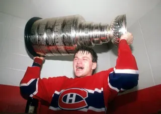 Claude Lemieux celebrates with the Stanley Cup after helping the Canadiens win the title in 1986.