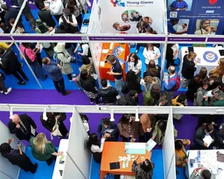 Crowds of mostly young people are attend the London Job Show employment fair at a shopping centre in London this month.