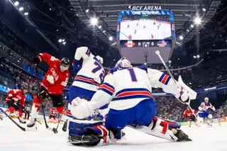 Canada’s Fraser Minten in action with Justin Faulk and Devin Cooley of the US.