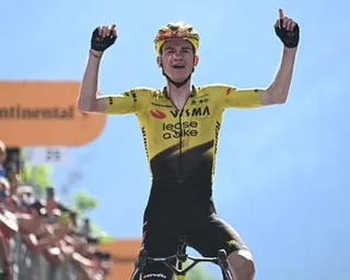 Sepp Kuss crosses the finish line on stage 19