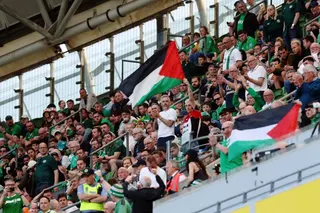 Palestine flags are displayed in the stands as part of a protest during the Ireland-Qatar match