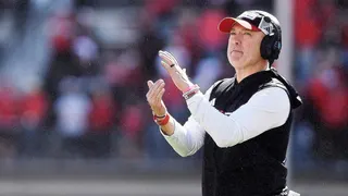 Texas Tech head coach Joey McGuire gestures for a timeout during a football game