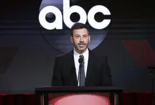 Jimmy Kimmel speaking on stage at an event with an ABC logo in the background.