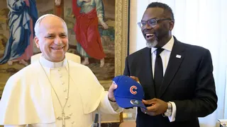 Chicago's Democratic mayor Brandon Johnson gifts Pope Leo XIV a Chicago Cubs hat