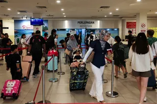 Travellers prepare to board a ferry at the Stulang Laut International Ferry Terminal in Johor Bahru on May 26, 2026. — Bernama pic