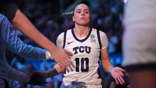 TCU's Hailey Van Lith jogging onto basketball court during introductions