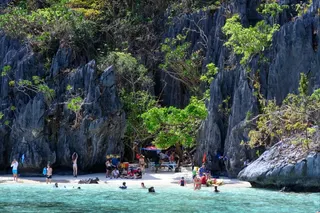 Tourists relax on a beach in Palawan province, the Philippines, last year. Photo: AFP