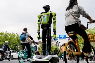 A humanoid robot police officer deployed on May 3 in Hangzhou, China. A 2025 survey by the Cheung Kong Graduate School of Business in Beijing found that 91 per cent of the respondents’ industries have already introduced AI.