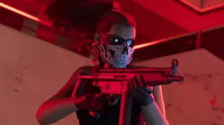 Lucia in GTA 6 aiming a weapon. She has her hair tied back and is wearing sunglasses and a mask to cover her face
