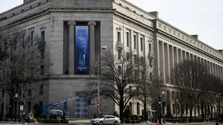 A banner featuring US President Donald Trump displayed on the US Department of Justice building facade in Washington, D.C.