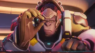 Winston adjusting his glasses while looking at a screen