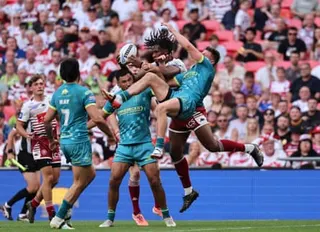 Wigan’s Junior Nsemba catches the ball above several Hull KR defenders