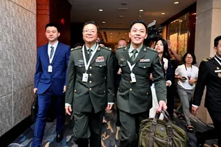 Major General Meng Xiangqing  (second from left)  leaves a special session at the Shangri-La Dialogue security forum in Singapore on Saturday. Photo: Reuters