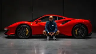 Shaun Baker Ferrari owner Shaun Baker posing for a picture with a bright red 488 Pista.