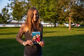 Kim Prosser poses for a portrait while holding a photo of her son Ashtyn Prosser, in Windsor, Ontario, Canada, on September 14, 2023. Ashtyn was one of at least 100 people who police say died after a Canadian man sold him a substance over the internet that was intended to assist people with suicides. Kenneth Law, a Canadian man accused of shipping poison to people contemplating suicide around the globe, is expected to plead guilty to several counts on May 29, 2026, ending a case that has shocked