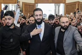 Syrian President Ahmed al-Sharaa, centre, at the Abdullah bin Abbas Mosque in Aleppo on Wednesday. Photo: SANA / AFP