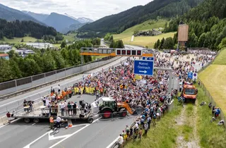 People demonstrate against transit traffic near the A13 Brenner Highway. — AFP pic