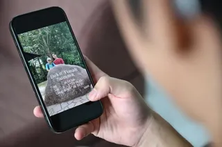 NTU undergraduate Samuel Chew with a photo of him and his late father during a trip to Bukit Timah Hill. The older man died in October 2025 after a cardiac arrest.