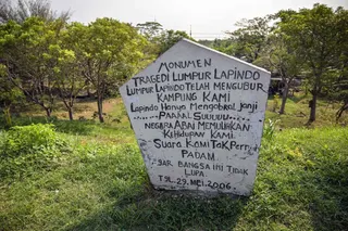 A memorial installed on the Lapindo mud embankment is pictured at the mud volcano area marking 20 years since a gas exploration accident triggered a mud flow that inundated more than a dozen villages and permanently displaced tens of thousands of people in Porong, Sidoarjo, East Java province on May 29, 2026. — AFP pic