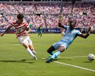 United States forward Christian Pulisic (10) shoots past Senegal forward Cherif Ndiaye (23) during the first half of an international friendly soccer match Sunday, May 31, 2026, in Charlotte, N.C.